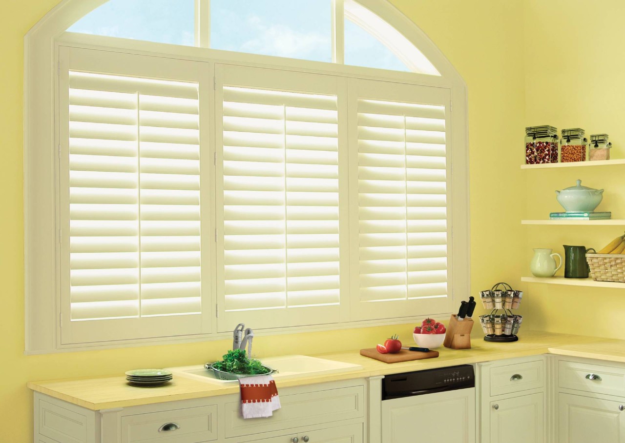 White window shutters in a yellow kitchen near Surrey, BC